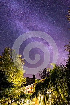 The milkyway behind a house