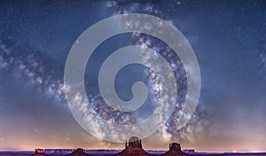 Milkyway over monument valley mountain range. Generative AI