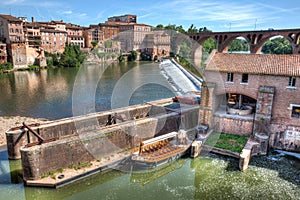 Mill and boat on the river in Albi Frnce