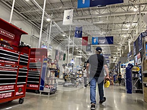 Mill Creek, WA USA - circa June 2022: Angled view of people shopping inside a Lowe`s home improvement store