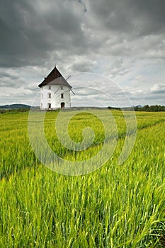 Mill house in field