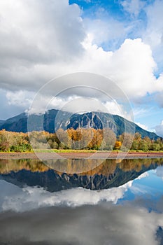 Mill Pond in Snoqualmie with reflection of Mount Si under towering clouds