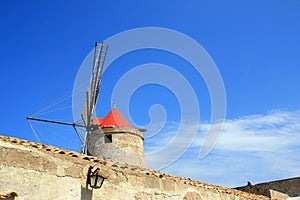 Mill roof on bue summer sky, Sicily
