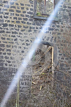 mill ruin with a ray of light