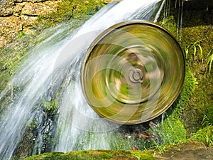 A mill wheel spins fast from the water_1