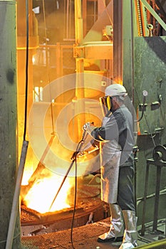 Mill worker with hot steel