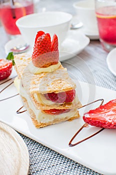 Mille feuille, puff pastry layered with strawberries and whipped