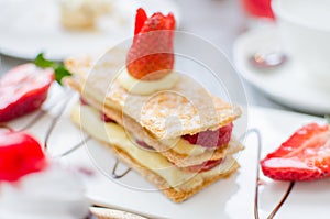 Mille feuille, puff pastry layered with strawberries and whipped photo