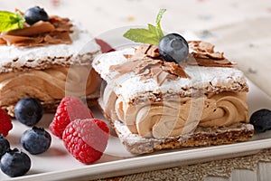 Millefeuille chocolate, decorated with berries and mint macro on