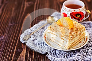 Millefeuille pastry with a cup of tea photo