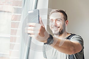 Millenial man taking a selfie. photo