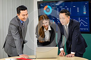 Millennial Asian professional successful male female businessmen and businesswoman in formal business suit standing smiling