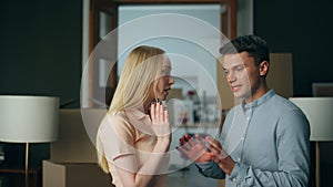 Millennial couple discussing disagreement at home gesturing emotionally close up