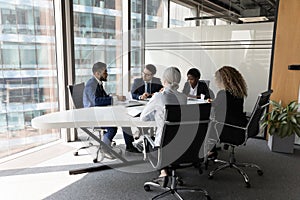 Millennial diverse different aged business team meeting in modern office