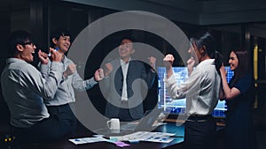 Millennial group of young businesspeople Asia businessman and businesswoman celebrate giving five after dealing and signing
