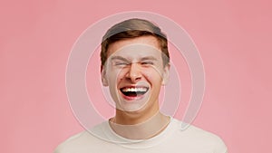 Millennial Guy Laughing Out Loud Having Fun Over Pink Background