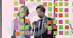 Millennial male mature female businesspeople plan task using kanban methodology