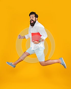 millennial man hurry with planner isolated on yellow. millennial man hurry with planner