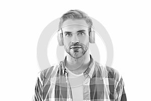 millennial man listen music isolated on white. millennial man wear music headphones in studio.