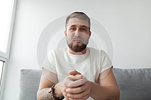 Millennial man making video call on laptop