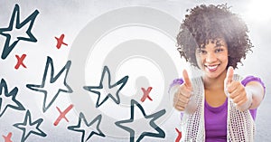 Millennial woman giving two thumbs up against white wall with red and blue hand drawn star pattern a