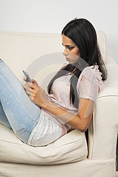 Intense texting on a couch