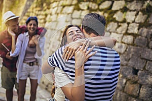 Millennials friends walking in city old town center on summer vacation