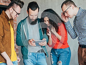 Millennials tablet diverse business team success