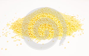 Millet groats on the white background