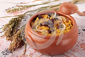 Millet porridge with boletus, bacon and onions