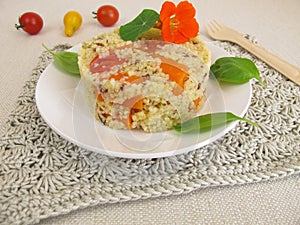 Millet turret with tomatoes, carrots and herbs