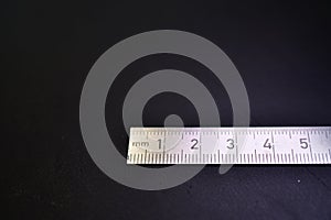 Millimeter Centimeter Steel Scale black Background Copyspace