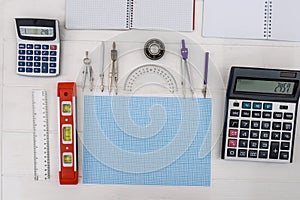 Millimeter paper with draft tools, calculator and notepads