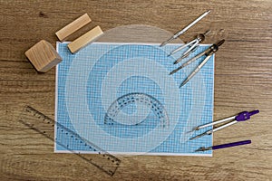 Millimeter paper with draw tools and wooden blocks