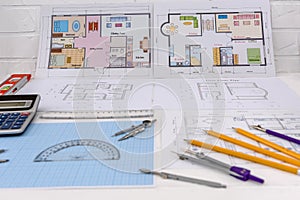 Millimeter paper with drawing tools and house plan