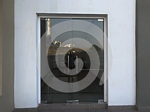 12 millimeters thick toughened Glass door with Stainless steel made tube glass Doors and its floor and lintel mounted Doors which photo