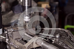 Milling details on a metal-cutting machine. production at a small enterprise