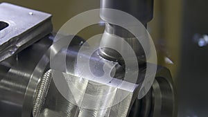 Milling machine cuts metal making part. Process of metalworking. Close-up