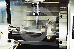 Milling metalworking process. Industrial CNC metal machining by vertical mill.