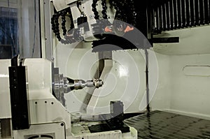 Milling metalworking process. Industrial CNC metal machining by vertical mill.