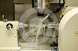 Milling metalworking process. Industrial CNC metal machining by vertical mill.