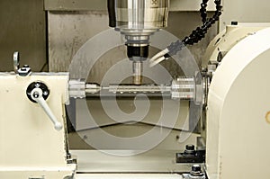 Milling metalworking process. Industrial CNC metal machining by vertical mill.