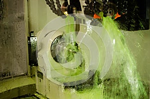 Milling metalworking process. Industrial CNC metal machining by vertical mill.