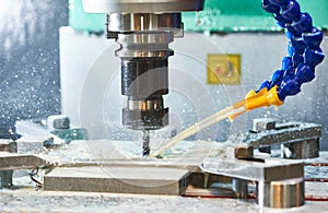Milling metalworking process. Industrial CNC metal machining by vertical mill photo