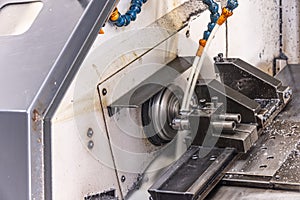 Milling metalworking process. Industrial CNC metalworking with vertical mill. Metalworking industry: cutting steel metal shaft