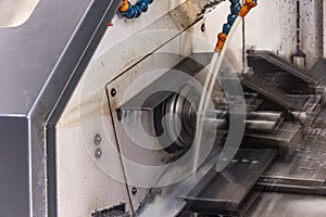 Milling metalworking process. Industrial CNC metalworking with vertical mill. Metalworking industry: cutting steel metal shaft