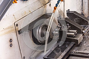 Milling metalworking process. Industrial CNC metalworking with vertical mill. Metalworking industry: cutting steel metal shaft