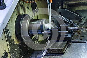 Milling metalworking process. Industrial CNC metalworking with vertical mill. Metalworking industry: cutting steel metal shaft