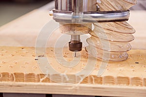Milling a wooden board. Processing of wood panels on CNC coordinate milling woodworking machines. CNC woodworking