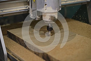 Milling a wooden board. Processing of wood panels on CNC coordinate milling woodworking machines. Slow motion video